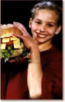 Gymnast eating a giant sandwich